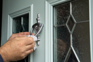 front door of home in massachusetts being replaced to improve home efficiency and overall comfort during the winter season